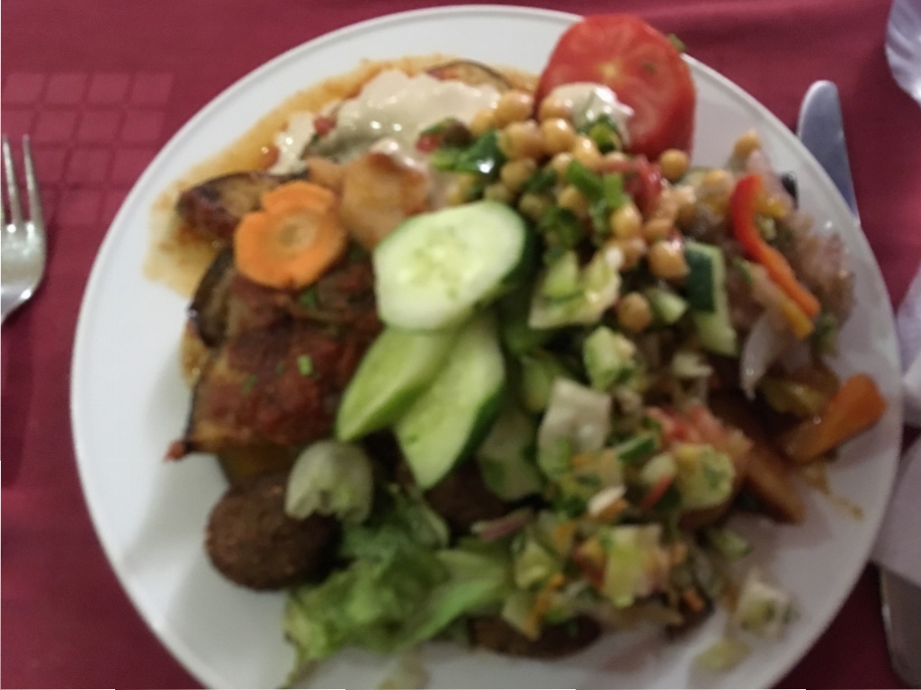 A lunch example of vegan options on a cruise-fruit, salad, beans