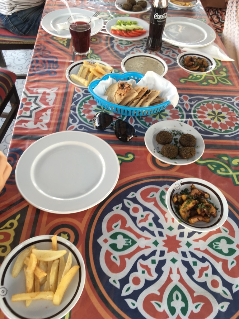 Lunch made vegan with chips, falafel, aubergine, bread, salad