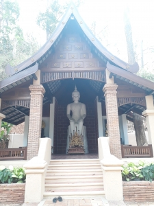 Temple at Wat Pha Lat with white Buddah statue